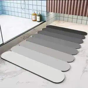 Absorberende badkamermat in verschillende grijstinten, antislip, voor douche en bad.