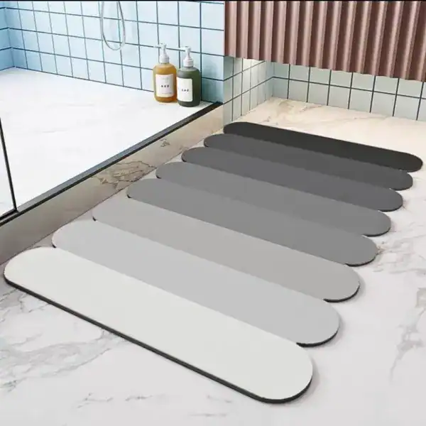Absorberende badkamermat in verschillende grijstinten, antislip, voor douche en bad.