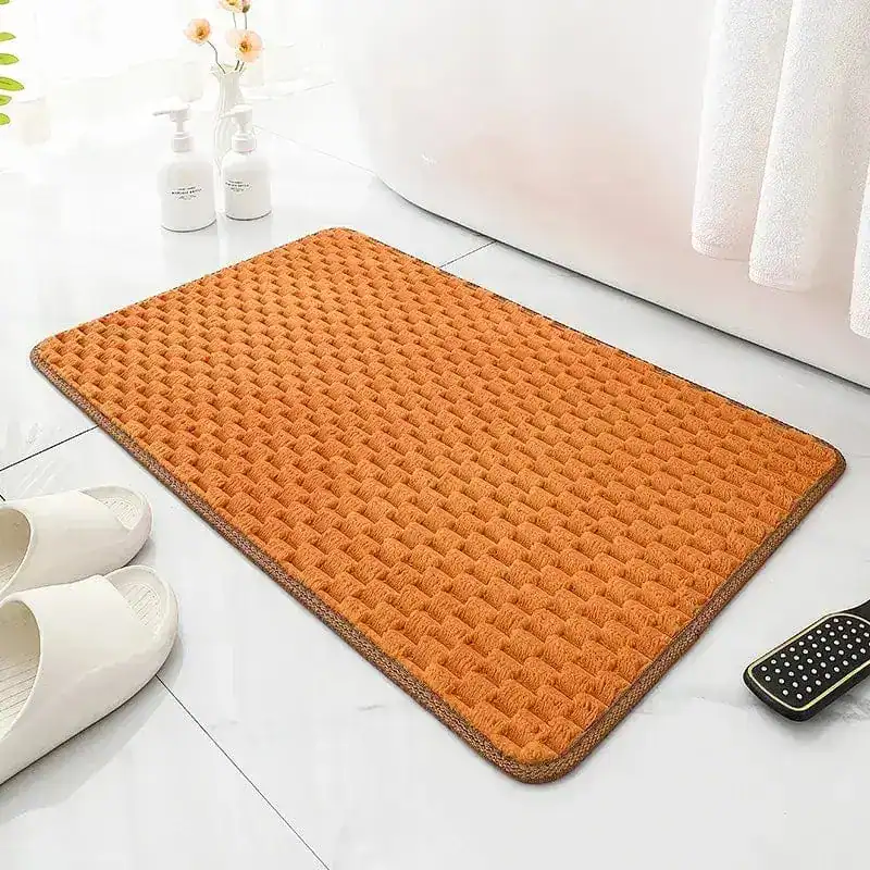 Oranje antislip badmat groot voor badkamer met textuur en rand.