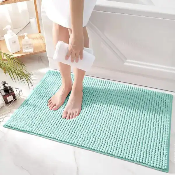 Aqua badmat met antislip textuur, lichtblauw, voor badkamer gebruik.