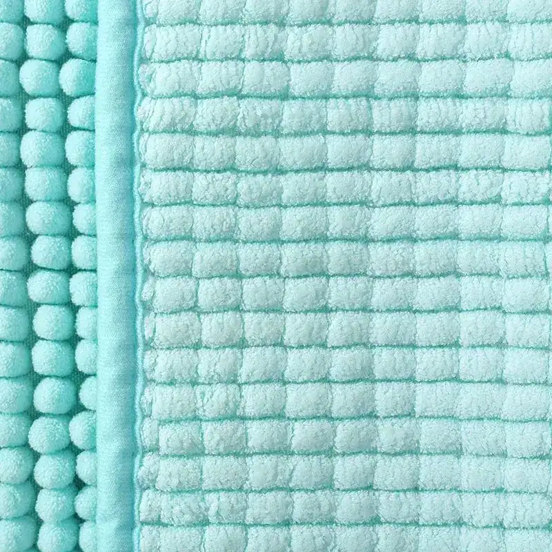 Aqua badmat met pomponrand en geribd oppervlak, antislip badkamermat.