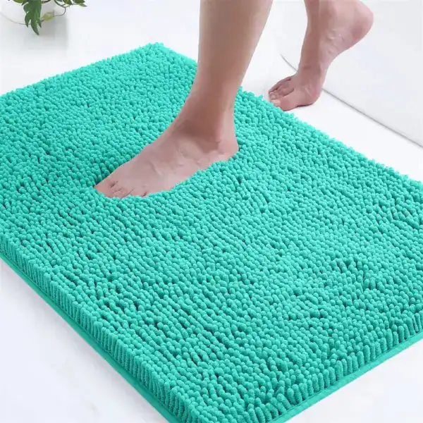 Turquoise badmat met antislip textuur, geschikt voor badkamer en douche.