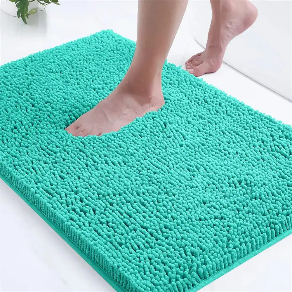 Turquoise badmat met antislip textuur, geschikt voor badkamer en douche.
