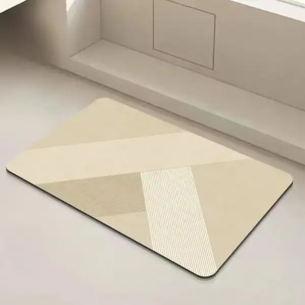 Antislip badmat 60x90 cm met geometrisch patroon in crèmekleur.