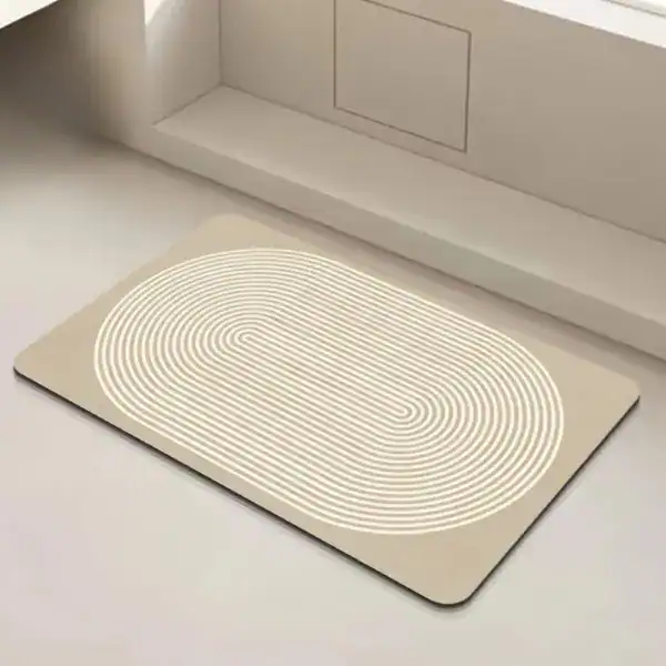 Badmat 60x90 antislip met witte concentrische lijnen op beige achtergrond.