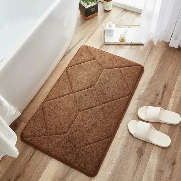 Beige badmat met antislip structuur voor badkamer en douche.