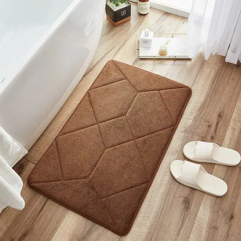 Beige badmat met antislip structuur voor badkamer en douche.