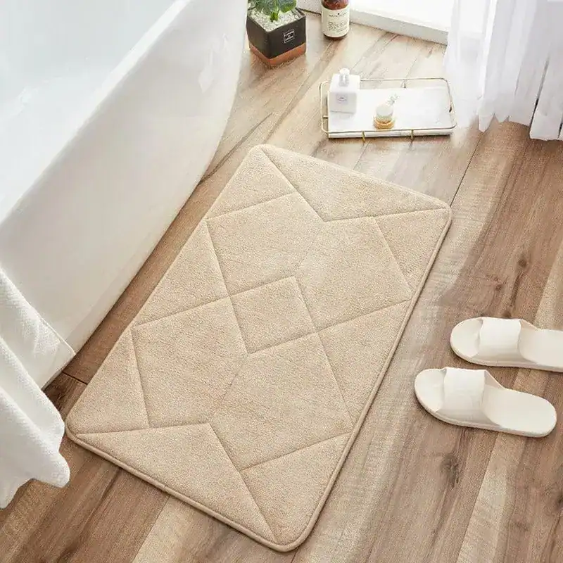 Beige badmat met antislip structuur voor de badkamer.