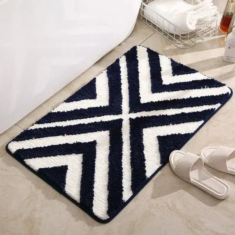 Badmat aqua blauw met witte zigzagpatronen, antislip, badkamermat.