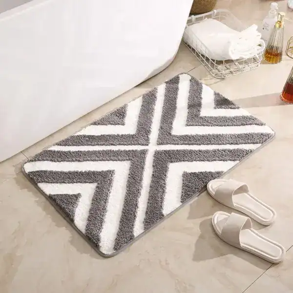 Badmat aqua blauw met grijs-wit zigzag patroon, antislip voor badkamer.