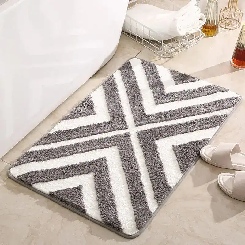 Badmat aqua blauw met grijs-wit zigzag patroon, antislip, badkamermat.