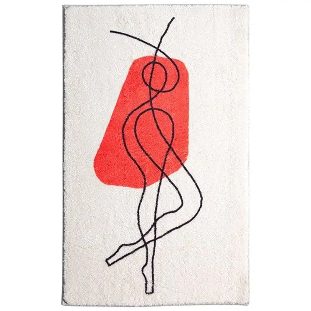 Badmat met abstracte rode en zwarte lijnafdruk op witte achtergrond.