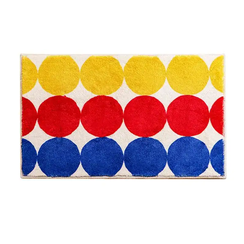 Badmat bubbels met rode gele en blauwe cirkels op witte achtergrond.