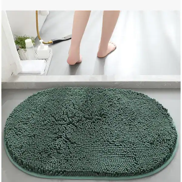 Groene ronde badmat met antislip textuur voor badkamer.