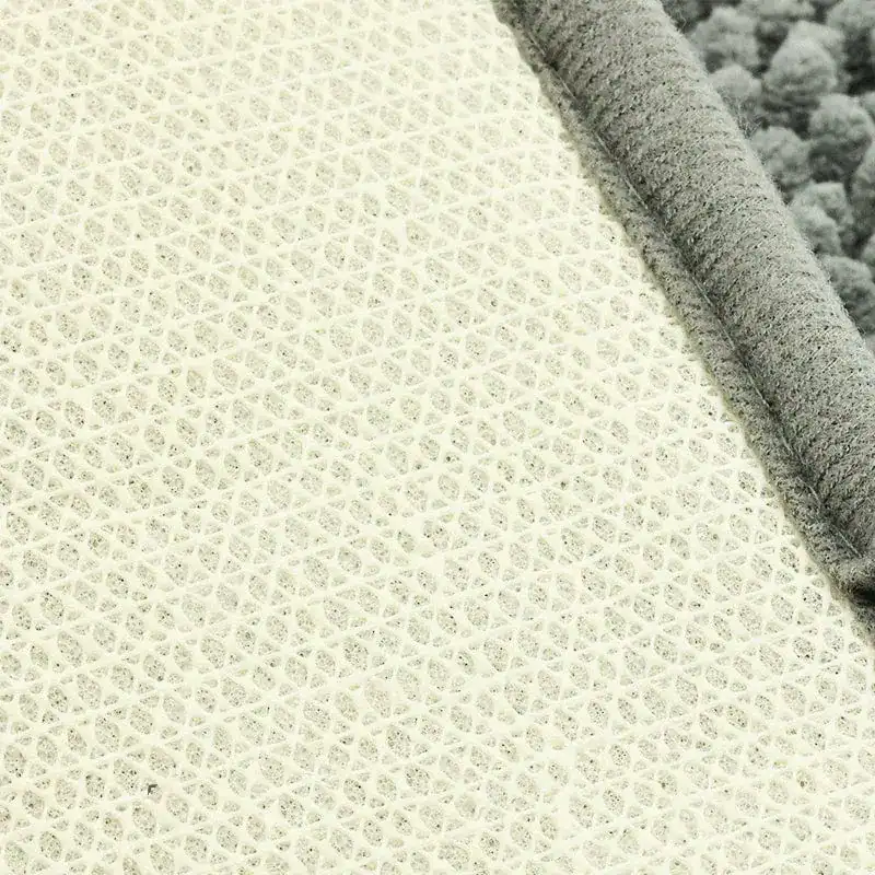 Groene ronde badmat met antislip textuur en grijze rand.