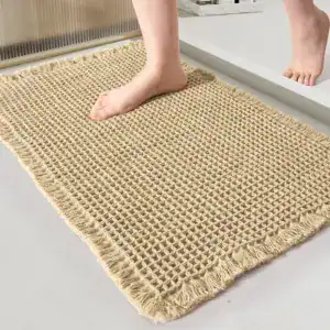 Badmat jute look met frans, antislip voor badkamer en douche.
