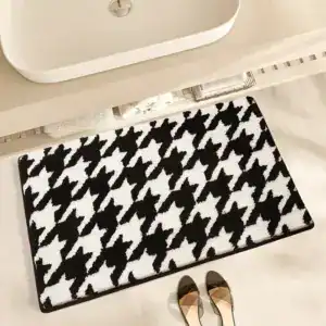 Badmat met houndstooth print, zwart-wit, antislip, voor badkamer.