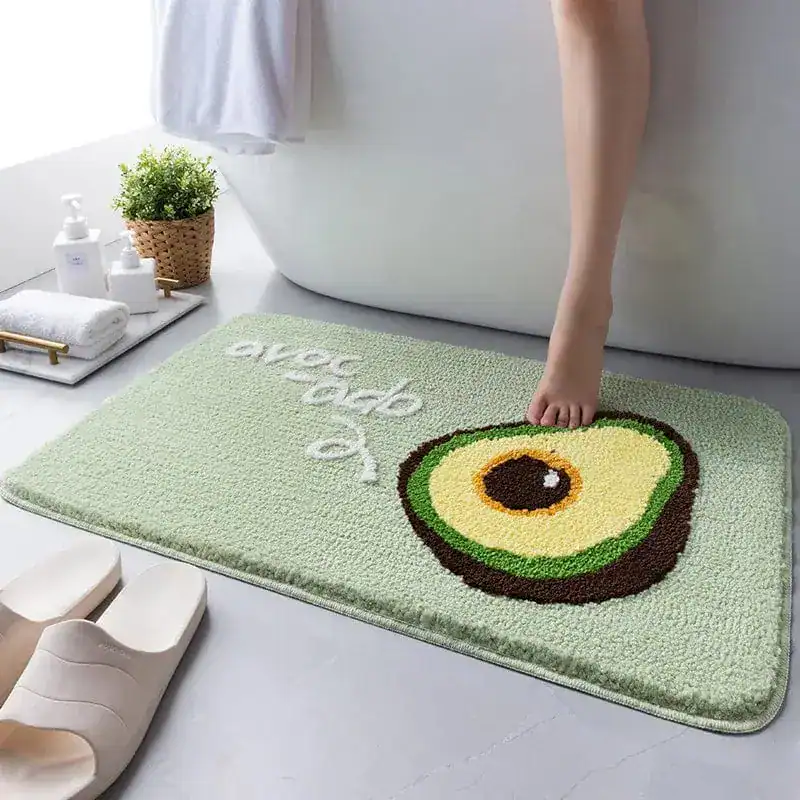 Mintgroene badmat met avocado print en witte tekst, antislip voor badkamer.