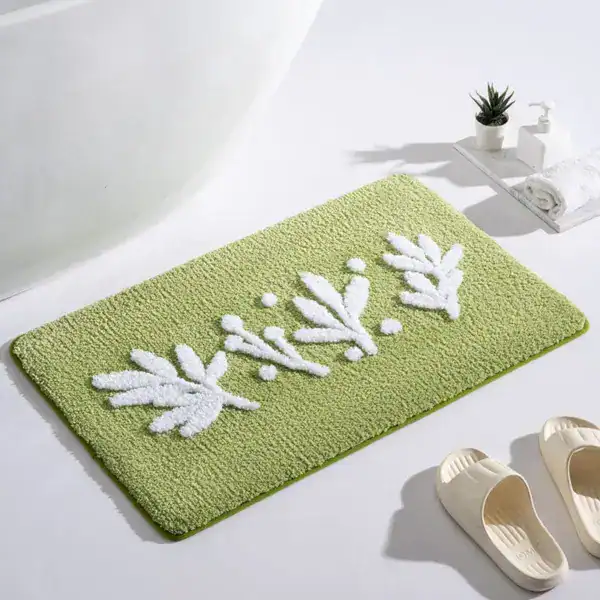 Olijfgroene badmat met witte bladmotief, antislip voor badkamer.