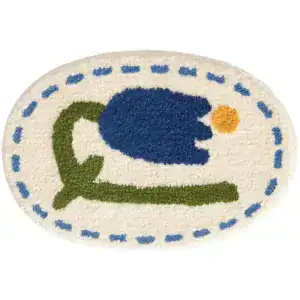 Ovaal badmat met blauwe tulpenprint en blauwe stippenrand.