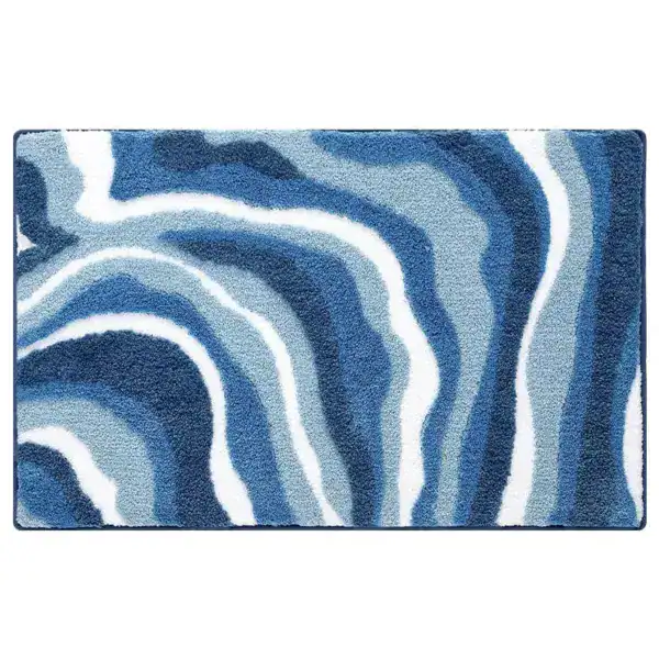 Badmat petrol blauw met zebra-achtige strepenpatroon, antislip badkamermat.
