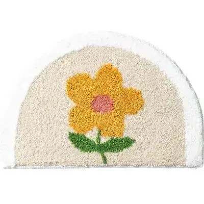 Ronde badmat wit met gele bloem, antislip badkamermat voor de douche.