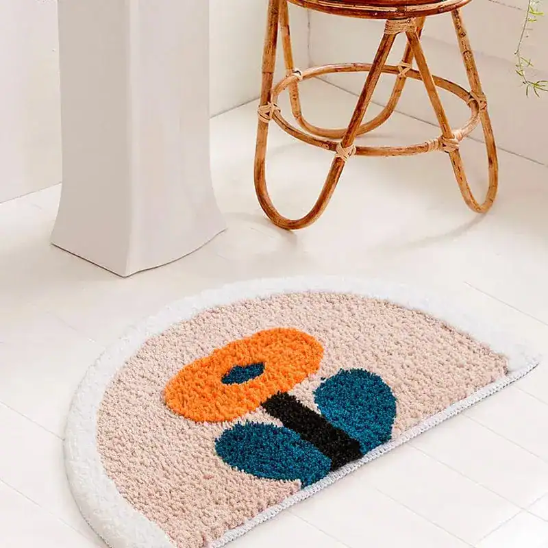 Ronde badmat wit met kleurrijke bloemmotief, antislip voor badkamer.
