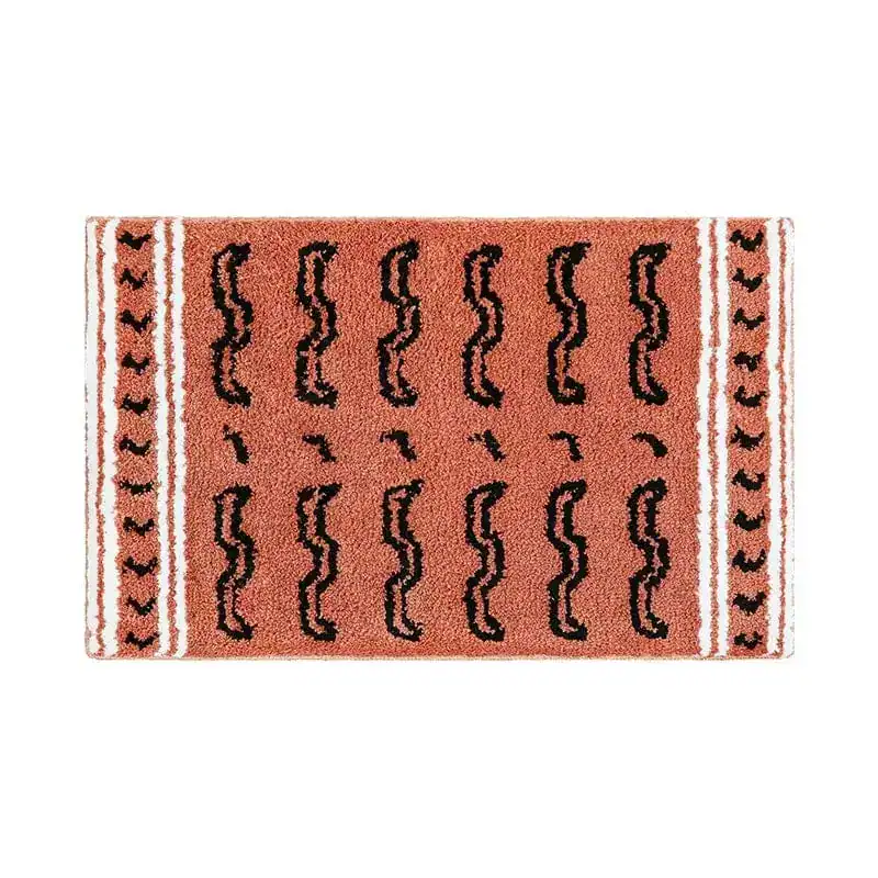 Badmat zwart beige met zigzag patroon en witte randen.