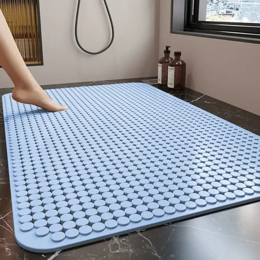 Blauwe douchemat met antislip textuur voor badkamer.
