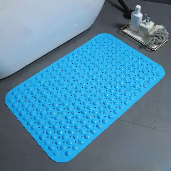Blauwe antislip douchemat met bolletjes voor de badkamer.