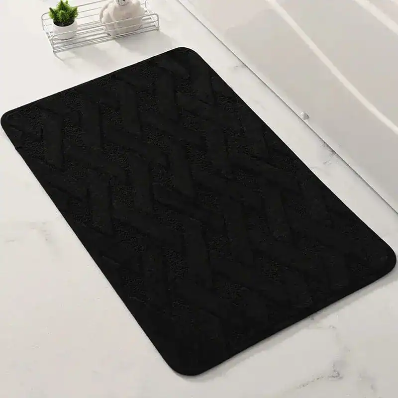 Zwarte geweven badmat met herringbone patroon, antislip voor badkamer.