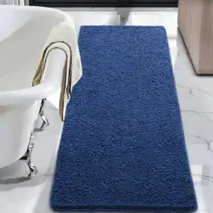 Grote blauwe badmat met antislip textuur voor de badkamer.