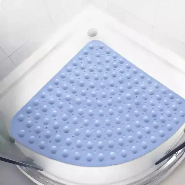 Hoek douchemat blauw met antislip textuur in witte douche.