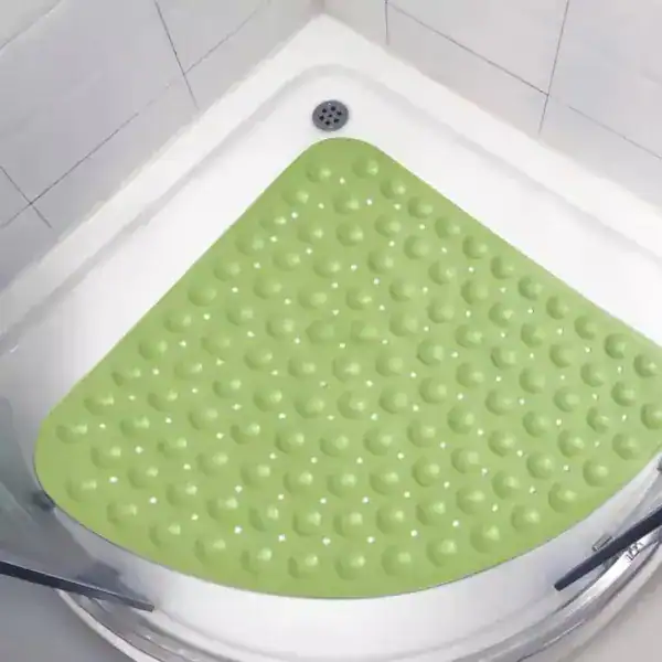 Hoek douchemat groen met antislip textuur in de douche.
