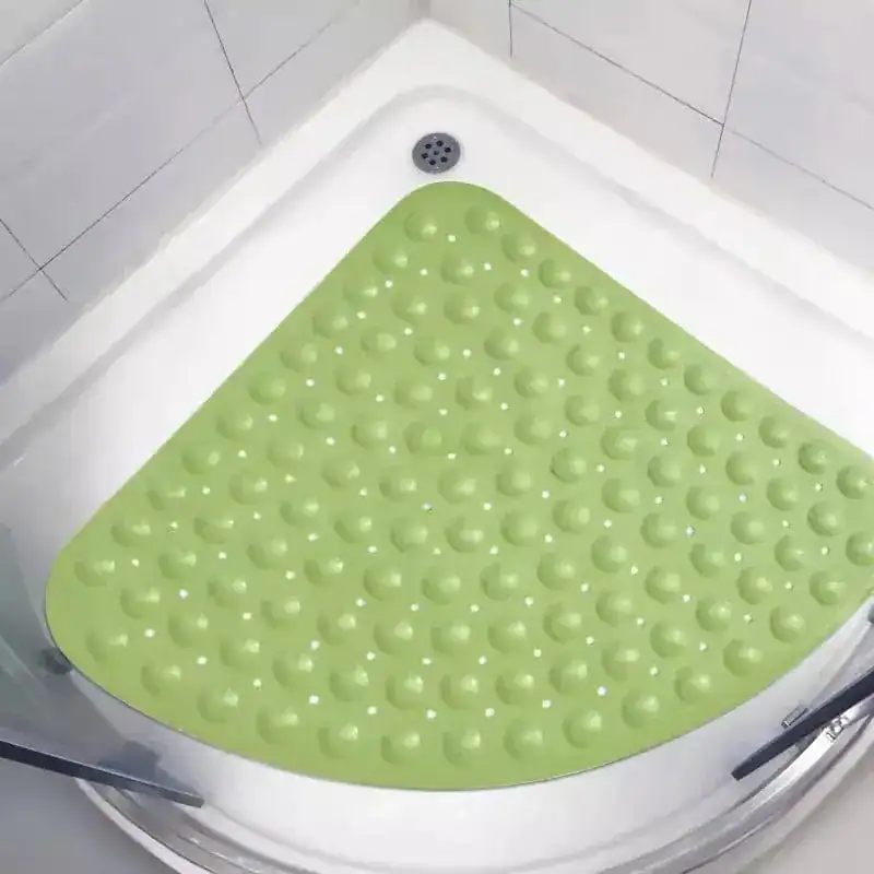 Hoek douchemat groen met antislip textuur in de douche.
