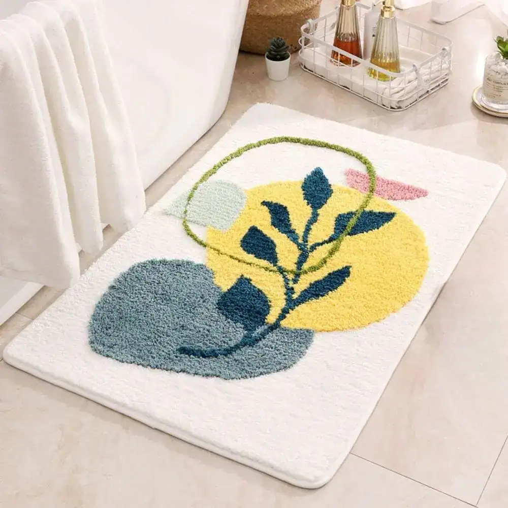Japandi badmat met bladmotief in blauw en geel, antislip badkamermat voor bad of douche.