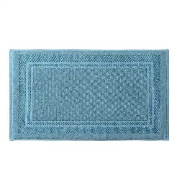 Blauwe katoen badmat met geborduurde rand, antislip voor badkamer.