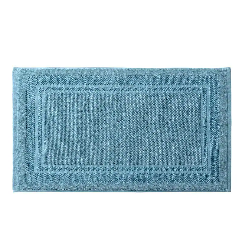 Blauwe katoen badmat met geborduurde rand, antislip voor badkamer.