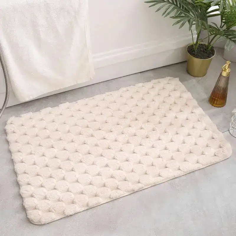 Luxe badkamermat met hexagonale textuur, antislip, beige.