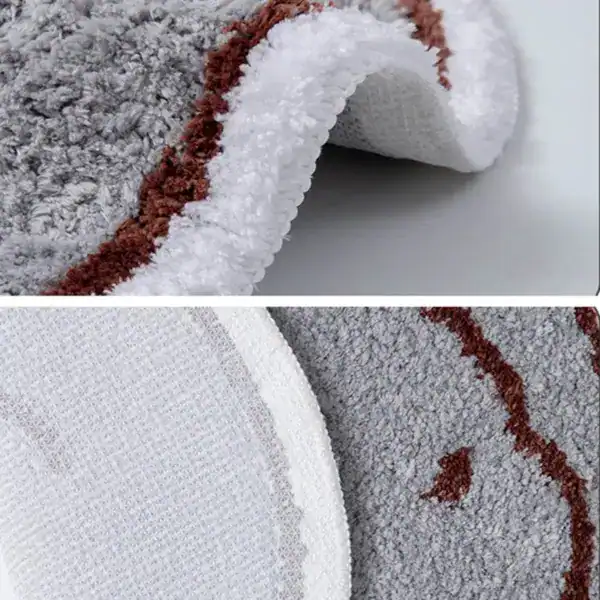 Ronde badmat met grijs vacht en bruin rand, antislip onderkant.
