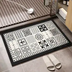 Zwart-wit rubber badmat met antislip patroon in de badkamer.