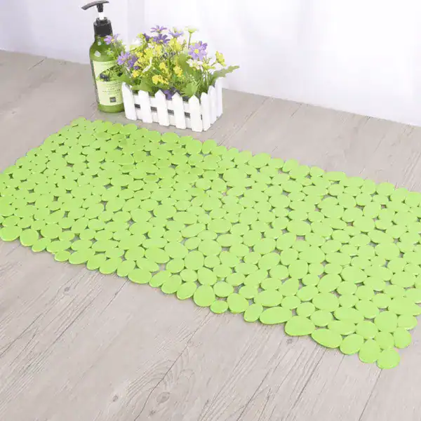 Groene rubber badmat met antislip textuur voor badkamer.