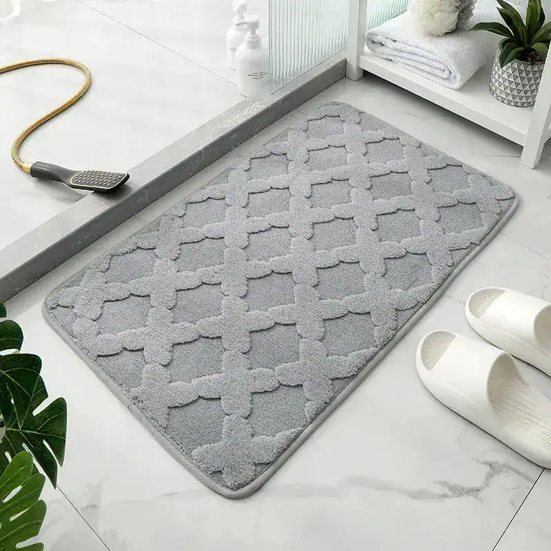 Grijze badmat met patroon, waterabsorberend, voor badkamer en douche.