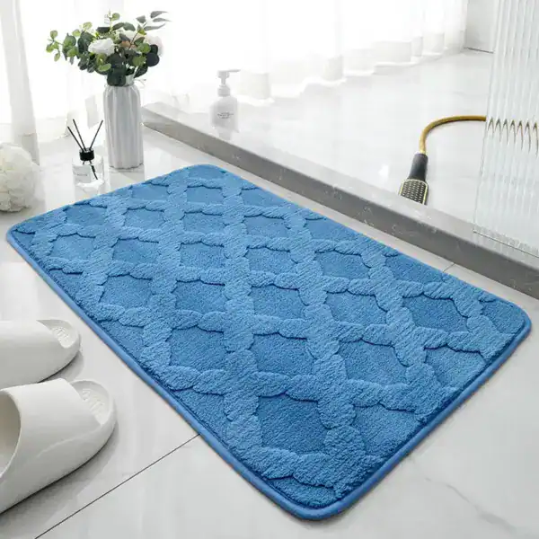 Blauwe badmat met patroon, geschikt voor badkamer en douche.
