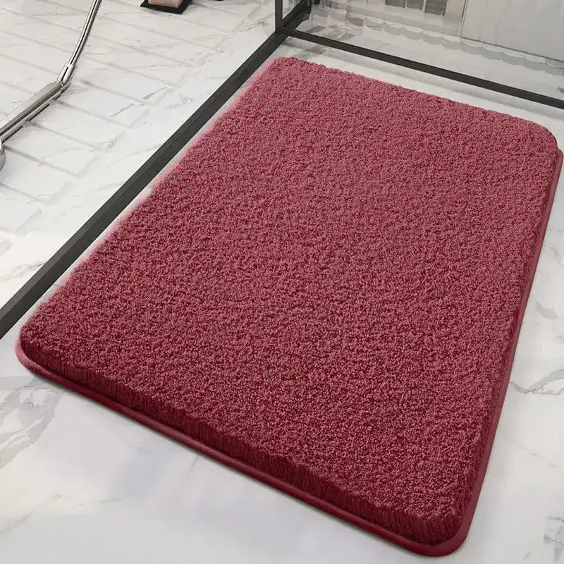 Zachte roze douchemat met antislip rand, voor badkamer gebruik.